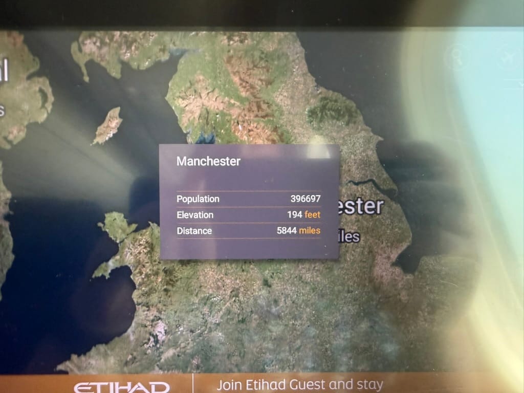 Etihad in-flight map showing Manchester as the journey origin, with a recorded distance of 5,844 miles from the city during the flight to Japan.