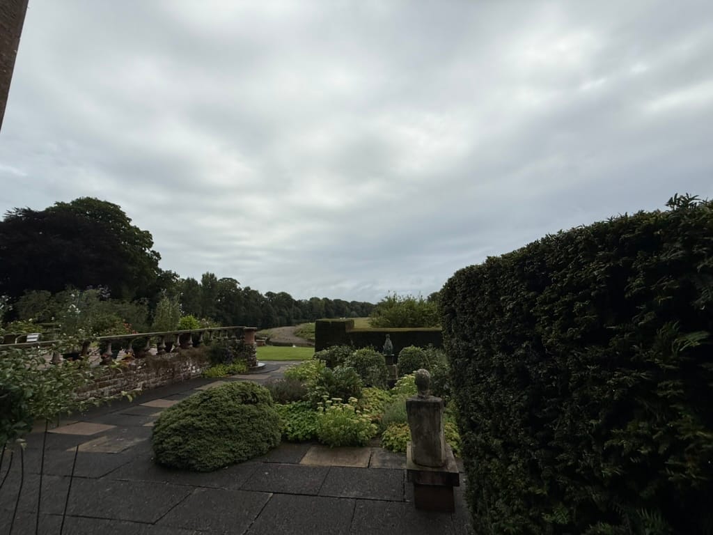 Formal gardens at Warwick Hall overlooking the surrounding countryside.