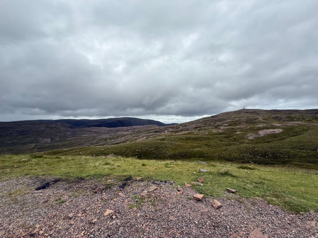 Rocky Highland landscape beneath heavy storm clouds.