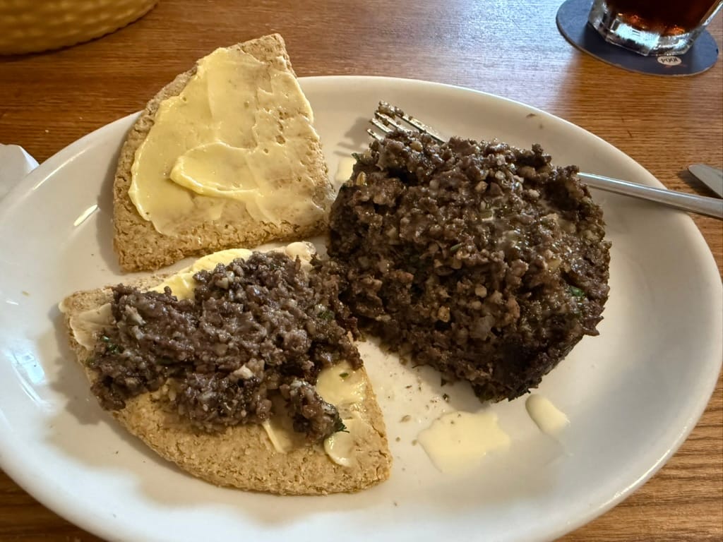 Haggis served with oatcakes and butter.