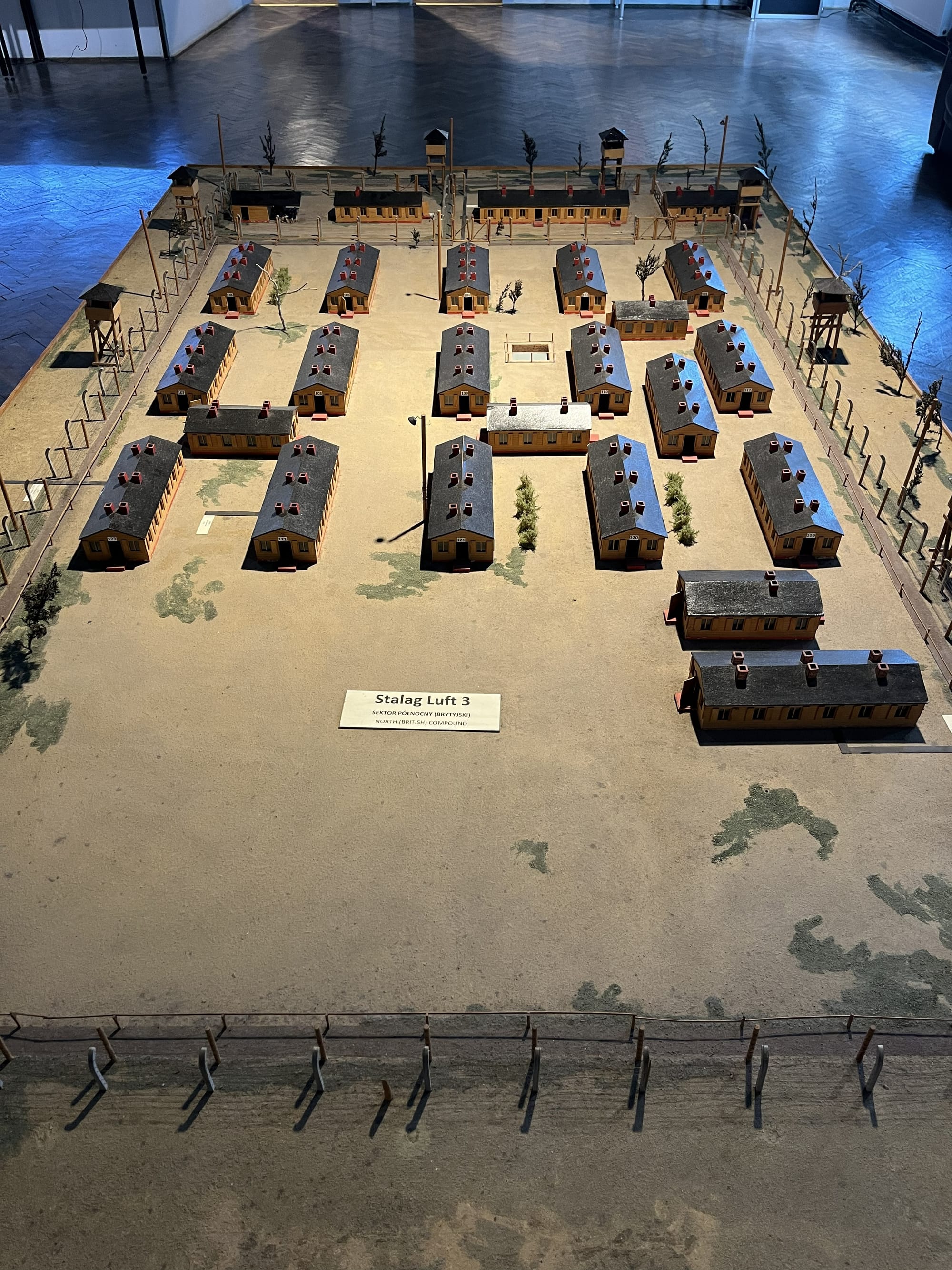 Scale model of the North Compound at Stalag Luft III, showing rows of prisoner barracks, watchtowers, perimeter fencing and camp buildings arranged within the former prisoner-of-war camp.