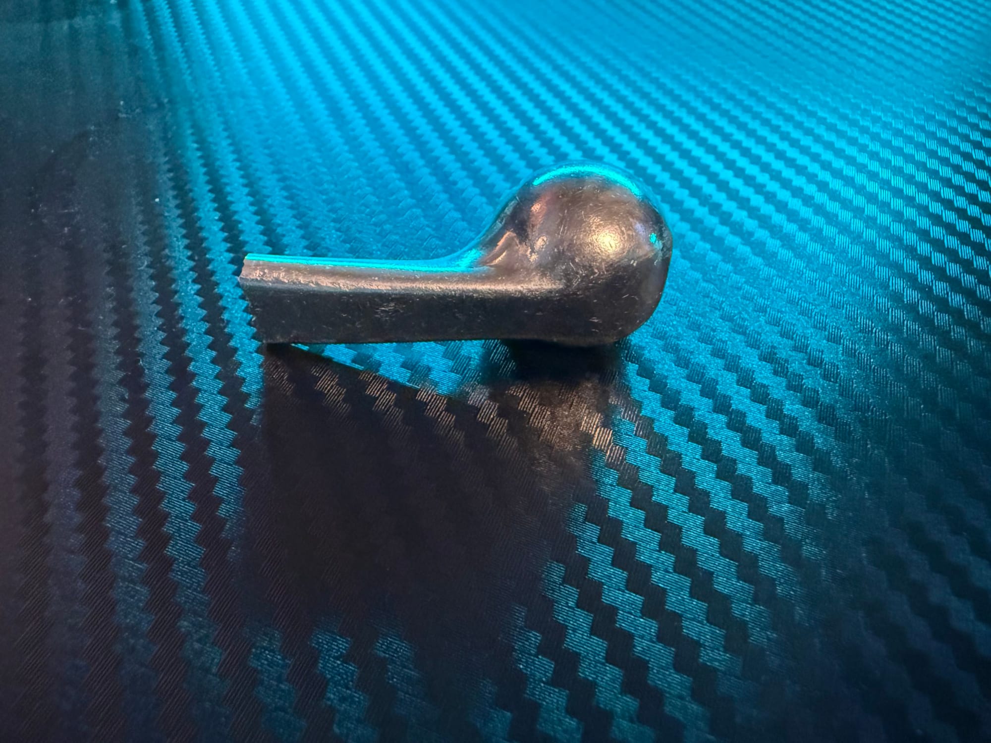 Snapped end of a motorcycle brake lever.