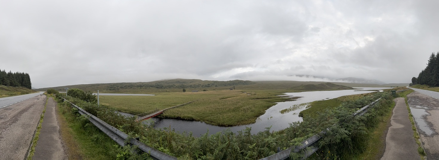 Panoramic view of marshland and loch beside the A890 under low cloud.