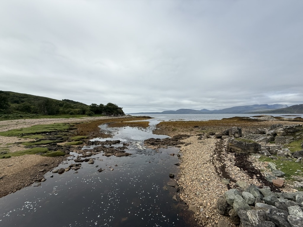 Rocky shoreline and tidal inlet on the Isle of Skye.