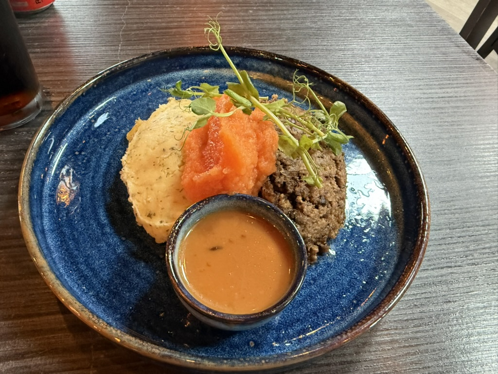Haggis, neeps and tatties served with whisky sauce.