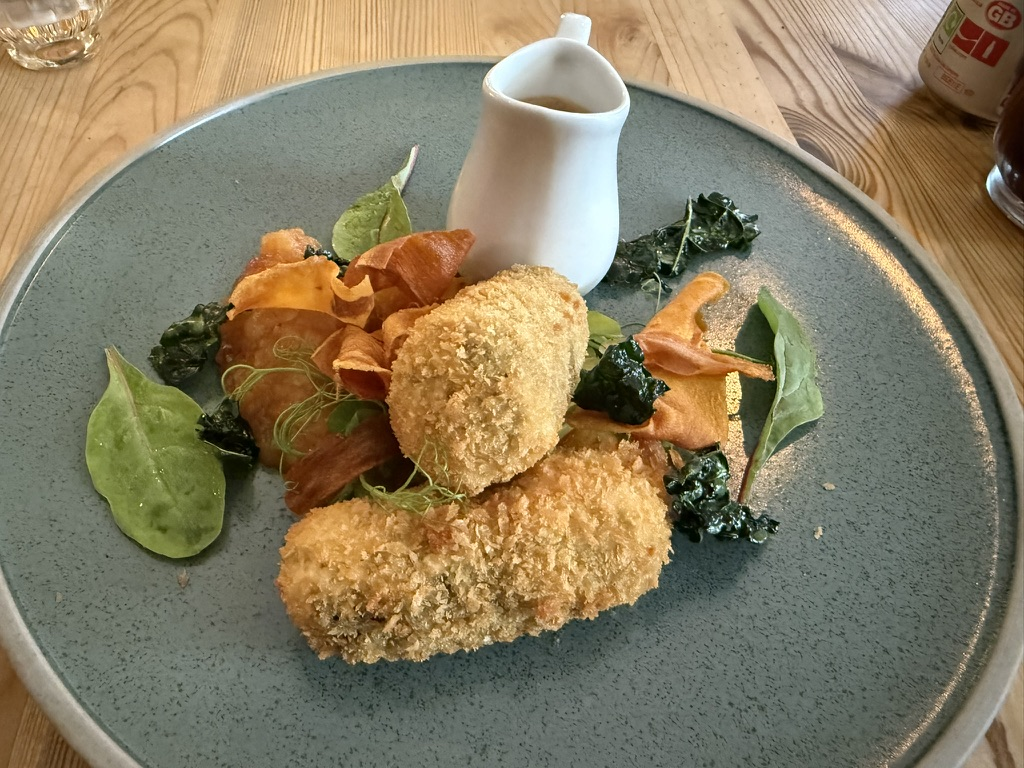 Haggis croquettes served with vegetables and gravy at Lochcarron Bistro.
