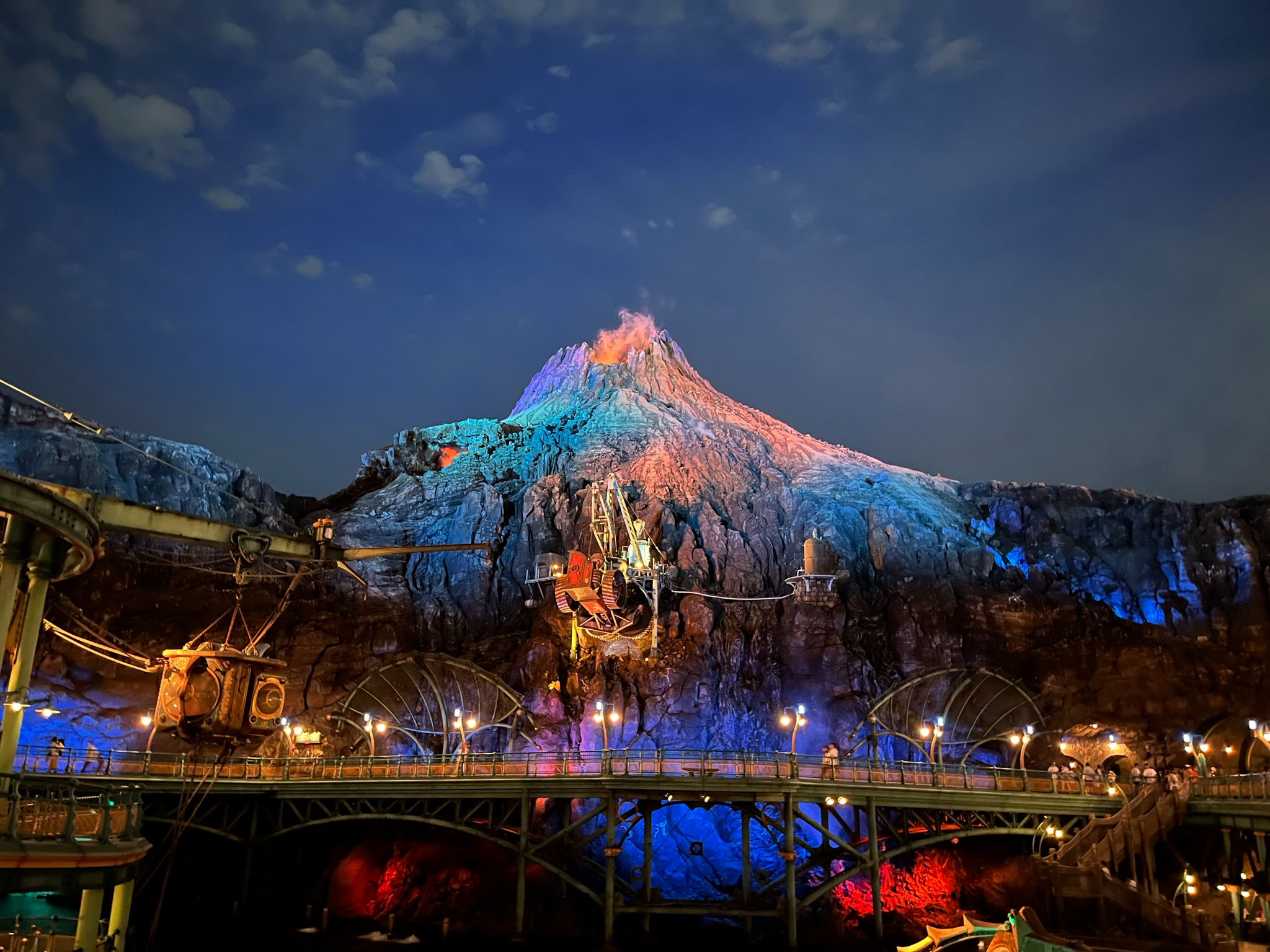 Mount Prometheus dominates the skyline of Tokyo DisneySea after dark, where the park's iconic volcano glows with dramatic lighting, eruptive effects and Jules Verne-inspired engineering, creating one of the most spectacular and atmospheric centrepieces in any Disney park worldwide.