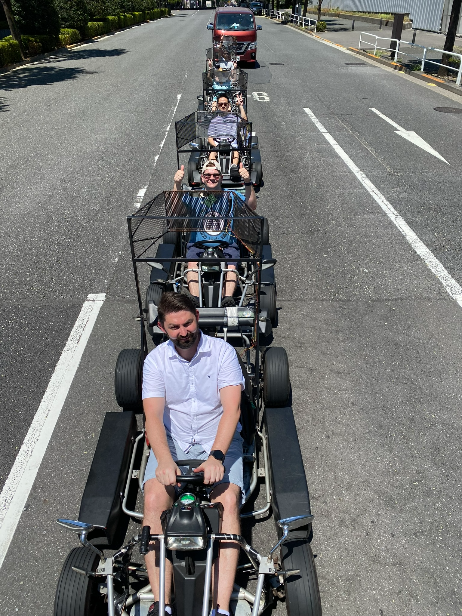 A group of travellers explores Tokyo from a unique perspective aboard street go-karts, following city roads in convoy and enjoying an unforgettable sightseeing experience through some of Japan's most vibrant urban neighbourhoods.