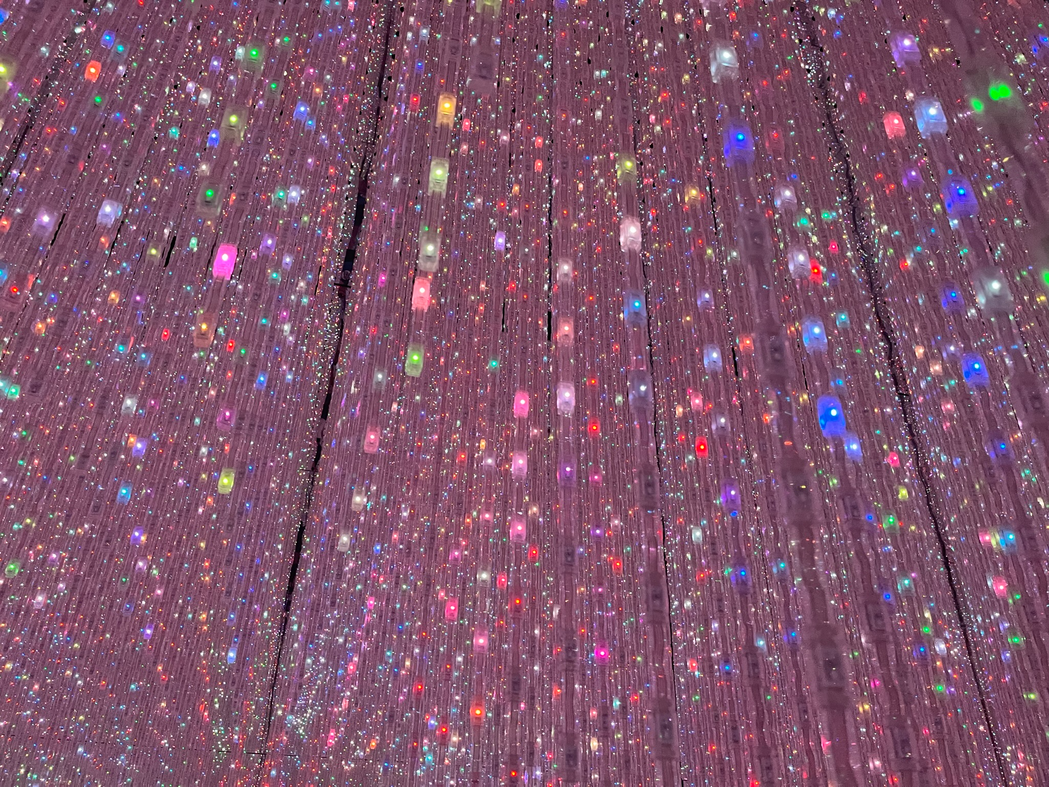 Thousands of suspended lights create an endless galaxy of colour inside TeamLab Planets Tokyo, where mirrors, reflections and digital art combine to immerse visitors in one of Japan's most captivating interactive installations.