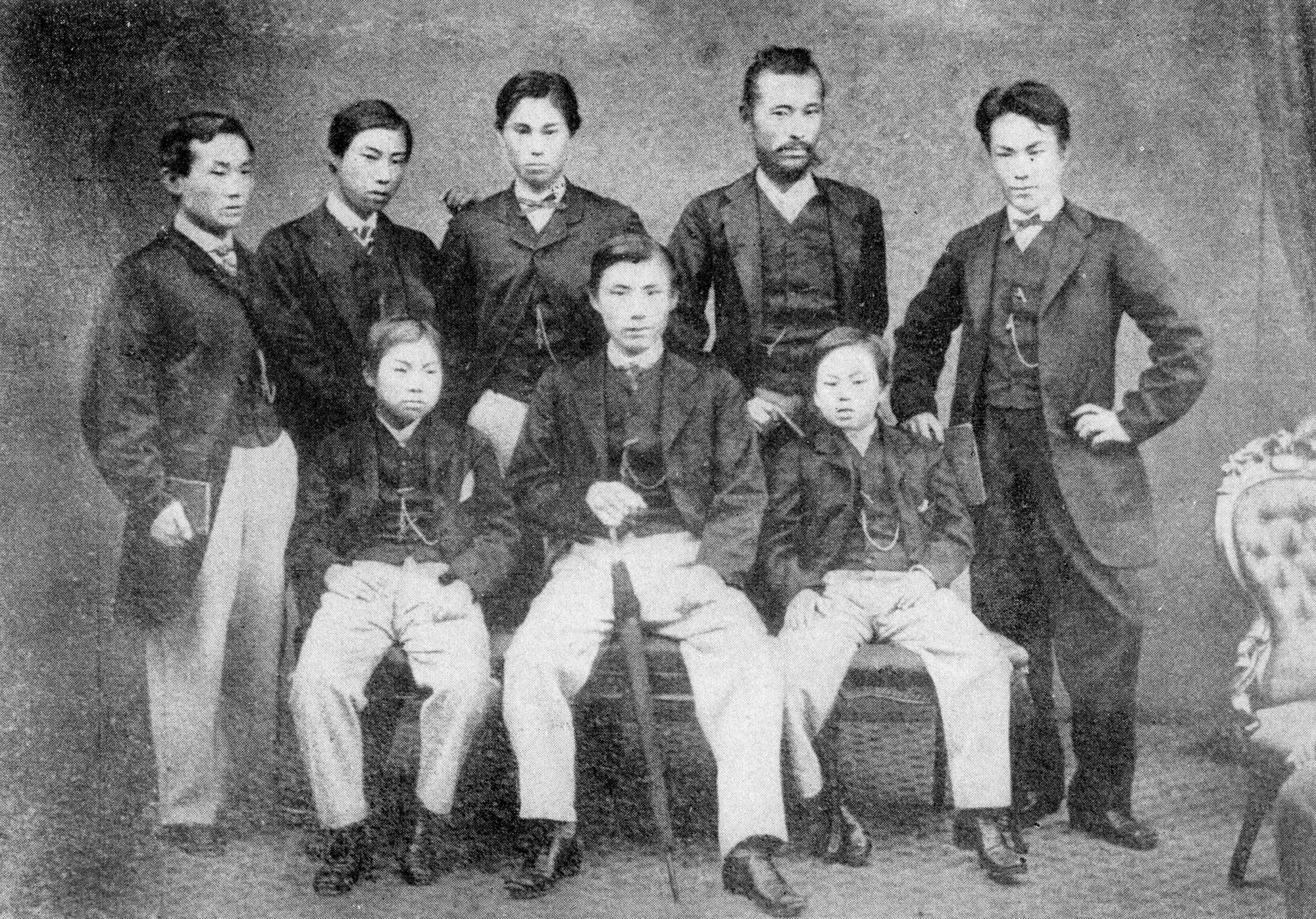 Historic photograph displayed at the Museum of the Meiji Restoration showing young Satsuma students in Western dress, taken during the period of Japan's modernisation.