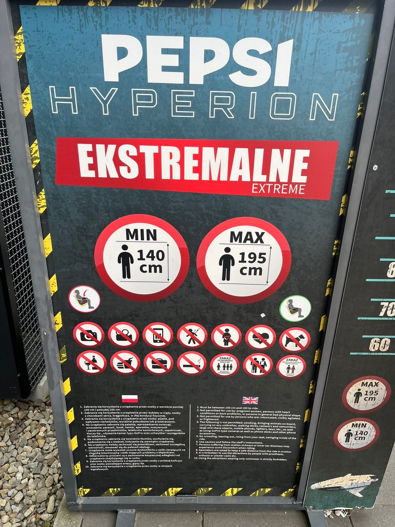 Safety information board at the entrance to Hyperion roller coaster at Energylandia, showing ride restrictions, safety rules and a height requirement of 140–195 cm.