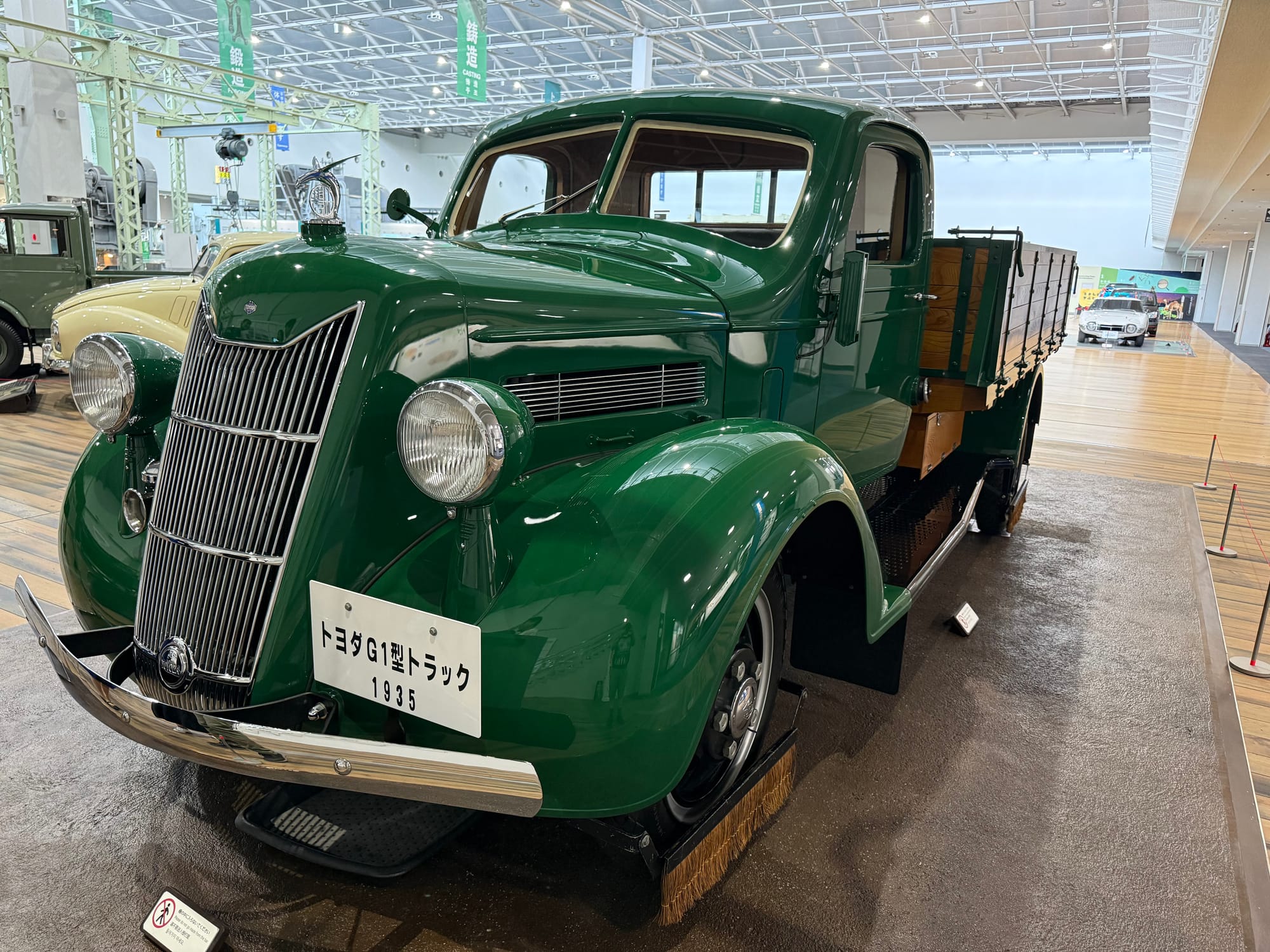 1935 Toyota G1 truck on display at the Toyota Commemorative Museum of Industry and Technology, featuring green bodywork and representing Toyota's first production truck.