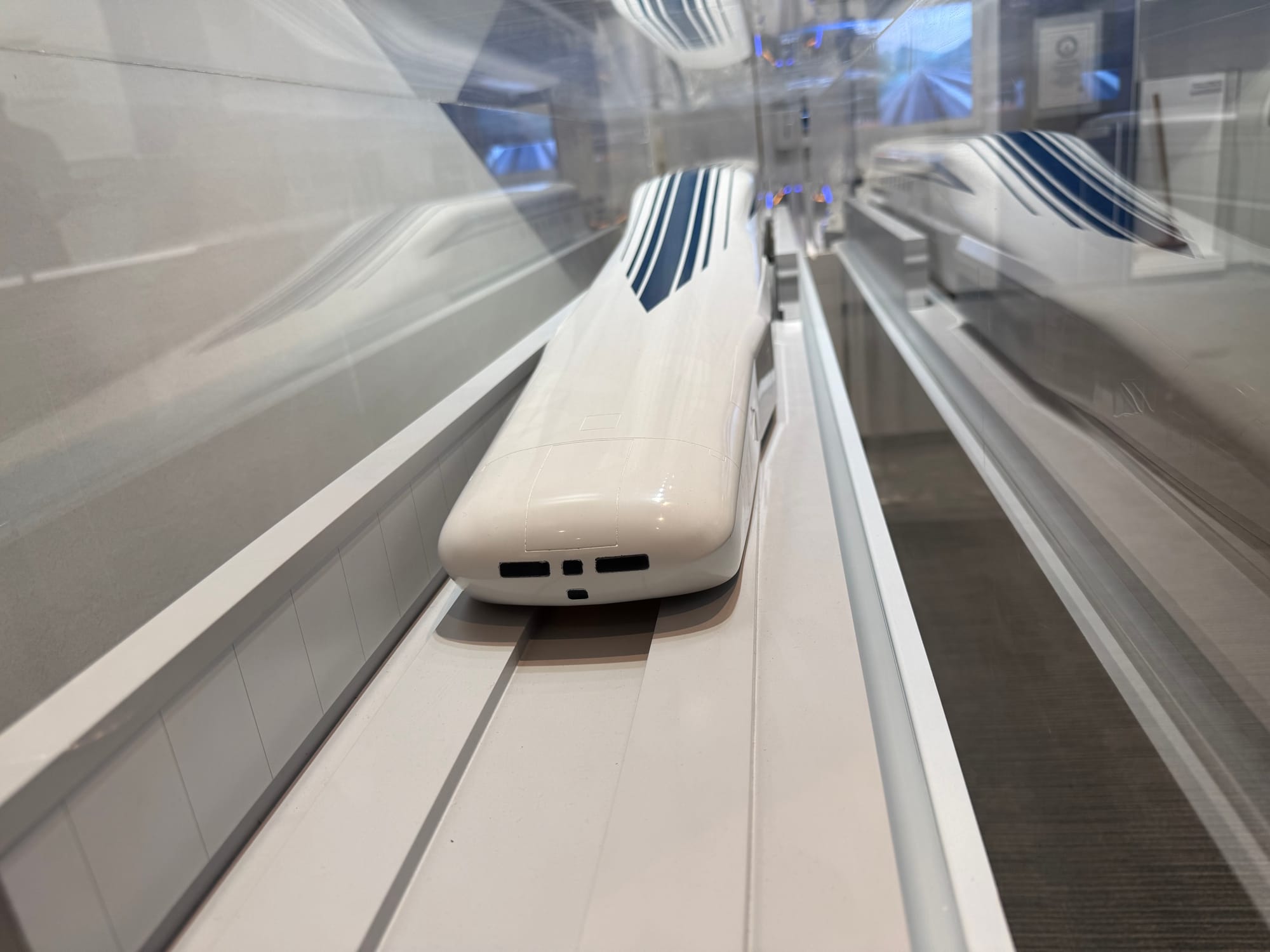 Scale model of a superconducting maglev train displayed at the SCMAGLEV and Railway Park in Nagoya, showing the streamlined design developed for Japan's future Chūō Shinkansen.