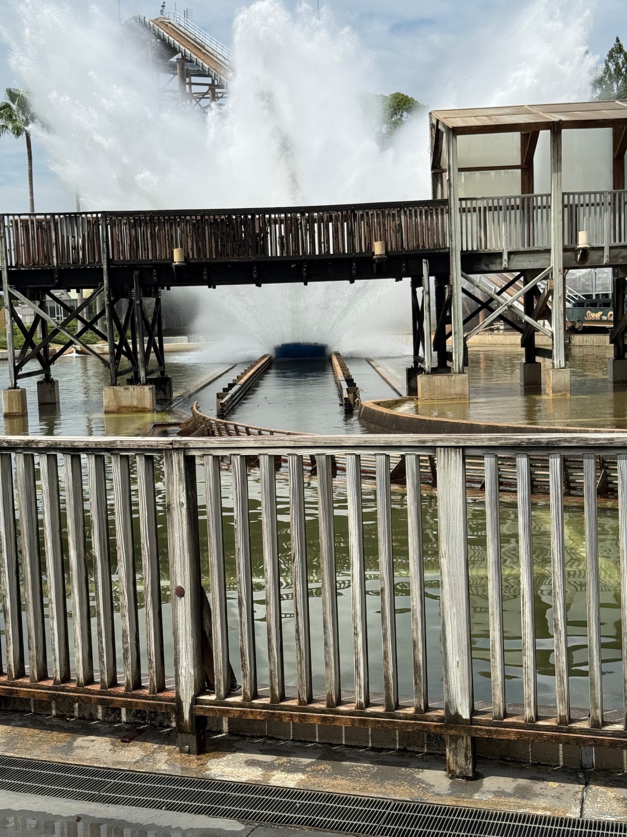 Boat from Shoot the Chute creates a huge splash at Nagashima Spa Land, sending walls of water high above the viewing bridge and surrounding water channel.