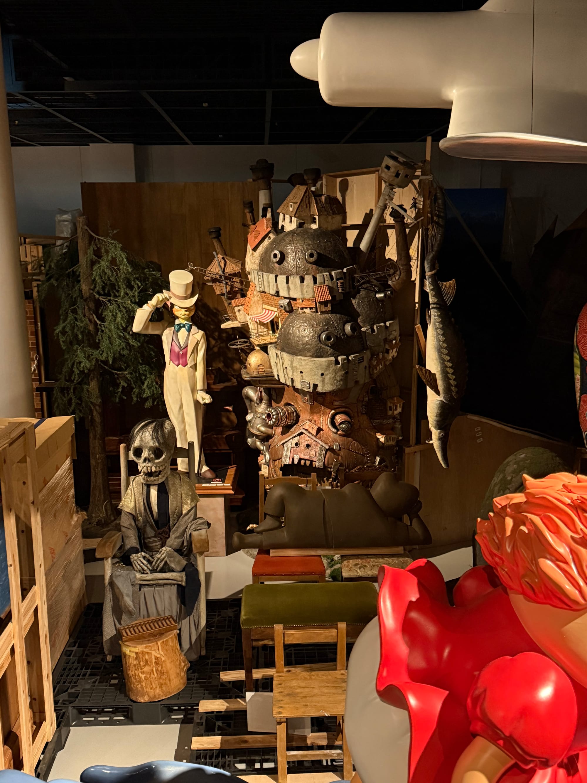 Display inside Ghibli Park's Grand Warehouse featuring models and props from Studio Ghibli films, including Howl's Moving Castle, Baron Humbert von Gikkingen and other characters.