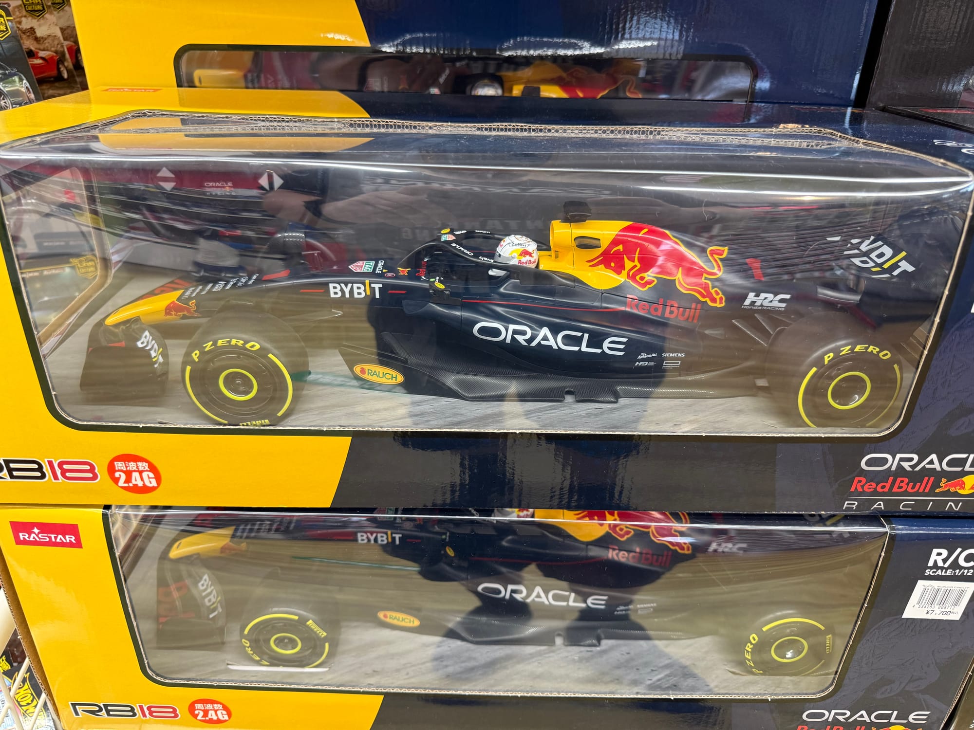 Boxed Oracle Red Bull Racing RB18 Formula One model car displayed in retail packaging, featuring Red Bull, Oracle and Honda HRC branding with the 2022 championship livery.