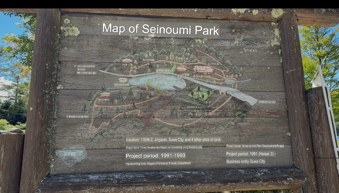 Illustrated map board along the route to Oniyama Observation Point, showing walking trails, viewpoints and facilities within Seinoumi Park on a weathered wooden sign.